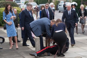 HARLOW, ENGLAND - SEPTEMBER 16: Catherine, Duchess of Cambridge looks on as Prince William, Duke of Cambridge helps up Jonathan Douglas-Hughes, vice Vice Lord-Lieutenant of Essex after his fall at Stewards Academy on September 16, 2016 in Harlow, England. (Photo by Samir Hussein/WireImage)