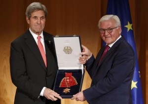 U.S. Secretary of State John Kerry receives the Grand Cross, First Class of the order of Merit of the Federal Republic of Germany from German Foreign Minister Frank-Walter Steinmeier (R) at the Foreign Ministry in Berlin, Germany, December 5, 2016.     REUTERS/Fabrizio Bensch