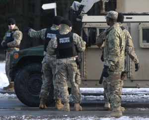A U.S. Army vehicle crosses the Polish border in Olszyna, Poland, Thursday, Jan. 12, 2017 heading for their new base in Zagan. First U.S. troops arrive in Zagan in western Poland as part of deterrence force of some 1,000 troops to be based here and reassure Poland that is worried about Russia's activity. (AP Photo/Czarek Sokolowski)